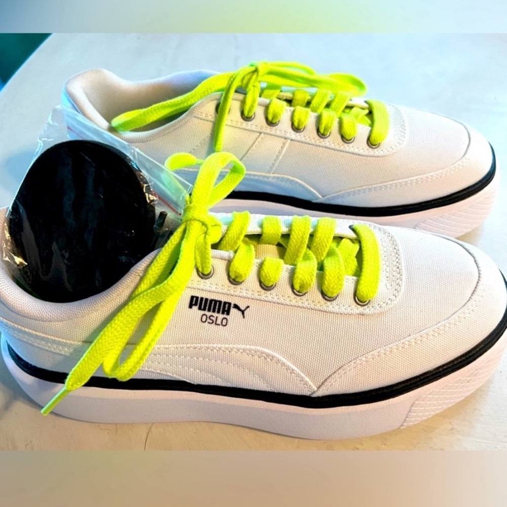 Brand New Pumas! Wedge Sneaker. Additional black laces. Never worn!